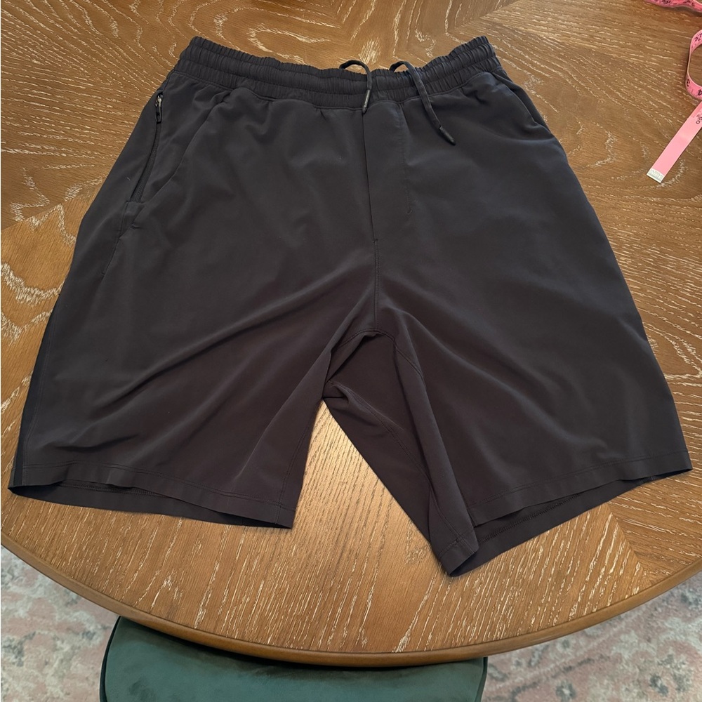 Perfect condition men’s medium black Lululemon athletic shorts no liners. 9” I.S